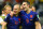 SALVADOR, BRAZIL - JUNE 13:  Arjen Robben (L) and Robin van Persie of the Netherlands walk off the field after scoring two goals each and defeating Spain 5-1 during the 2014 FIFA World Cup Brazil Group B match between Spain and Netherlands at Arena Fonte Nova on June 13, 2014 in Salvador, Brazil.  (Photo by Quinn Rooney/Getty Images)