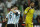 Argentina's Lionel Messi is hugged by Lucas Biglia after Argentina defeated the Netherlands 4-2 in a penalty shootout after a 0-0 tie after extra time to advance to the finals during the World Cup semifinal soccer match between the Netherlands and Argentina at the Itaquerao Stadium in Sao Paulo Brazil, Wednesday, July 9, 2014. (AP Photo/Natacha Pisarenko)