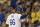 Los Angeles Dodgers' Yasiel Puig points toward first base after scoring on a single by Scott Van Slyke during the fourth inning of a baseball game against the San Diego Padres, Thursday, July 10, 2014, in Los Angeles. (AP Photo/Mark J. Terrill)