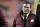 FILE - In this Dec. 1, 2013, file photo, Washington Redskins owner Dan Snyder walks off the field before an NFL football game against the New York Giants in Landover, Md. Washington Redskins owner Dan Snyder said Tuesday, April 22, 2014, it's time for people to