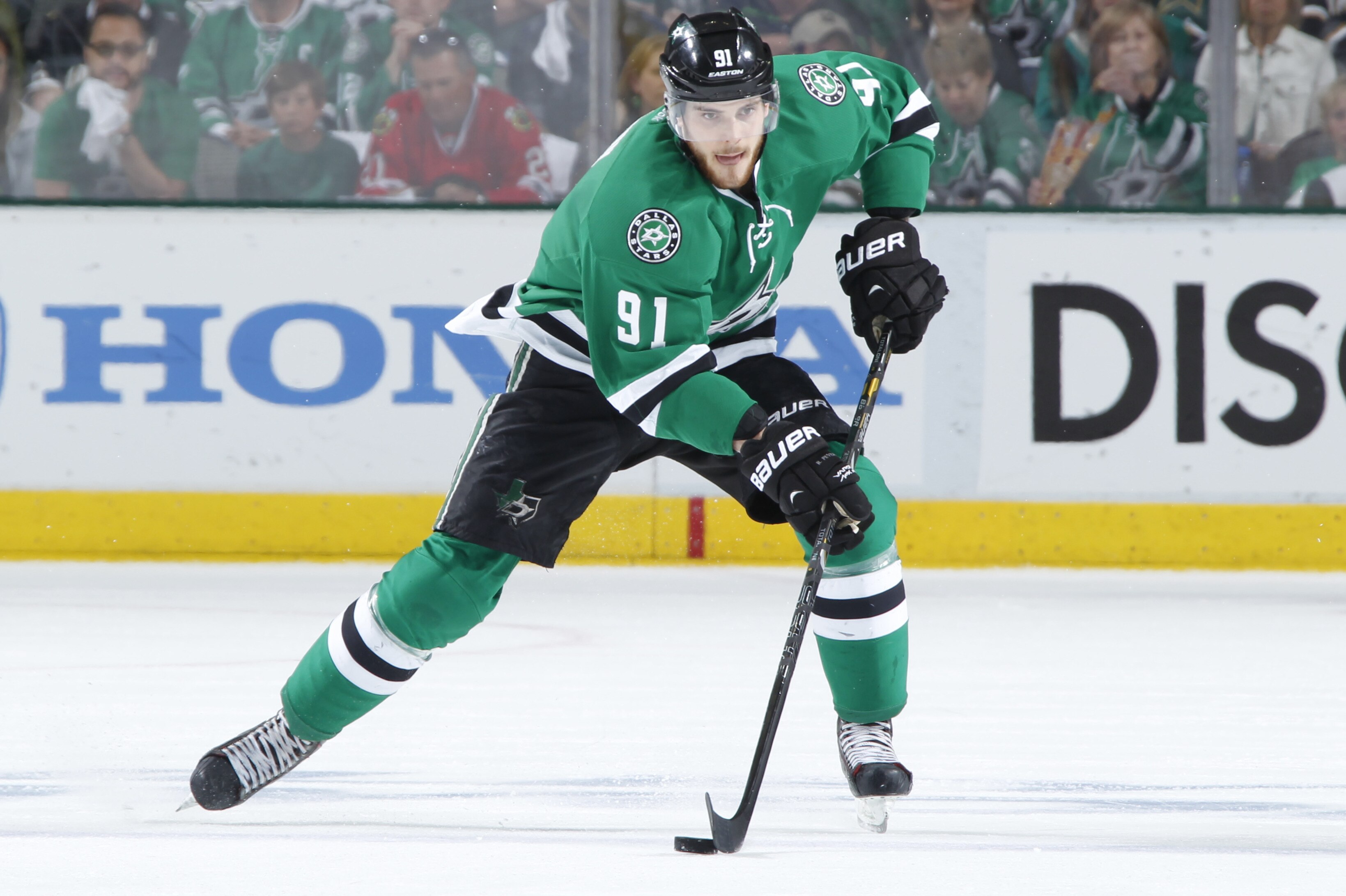 DALLAS, TX - APRIL 27: Tyler Seguin #91 of the Dallas Stars handles the puck against the Anaheim Ducks in Game Six of the First Round of the 2014 Stanley Cup Playoffs at the American Airlines Center on April 27, 2014 in Dallas, Texas. (Photo by Glenn James/NHLI via Getty Images)