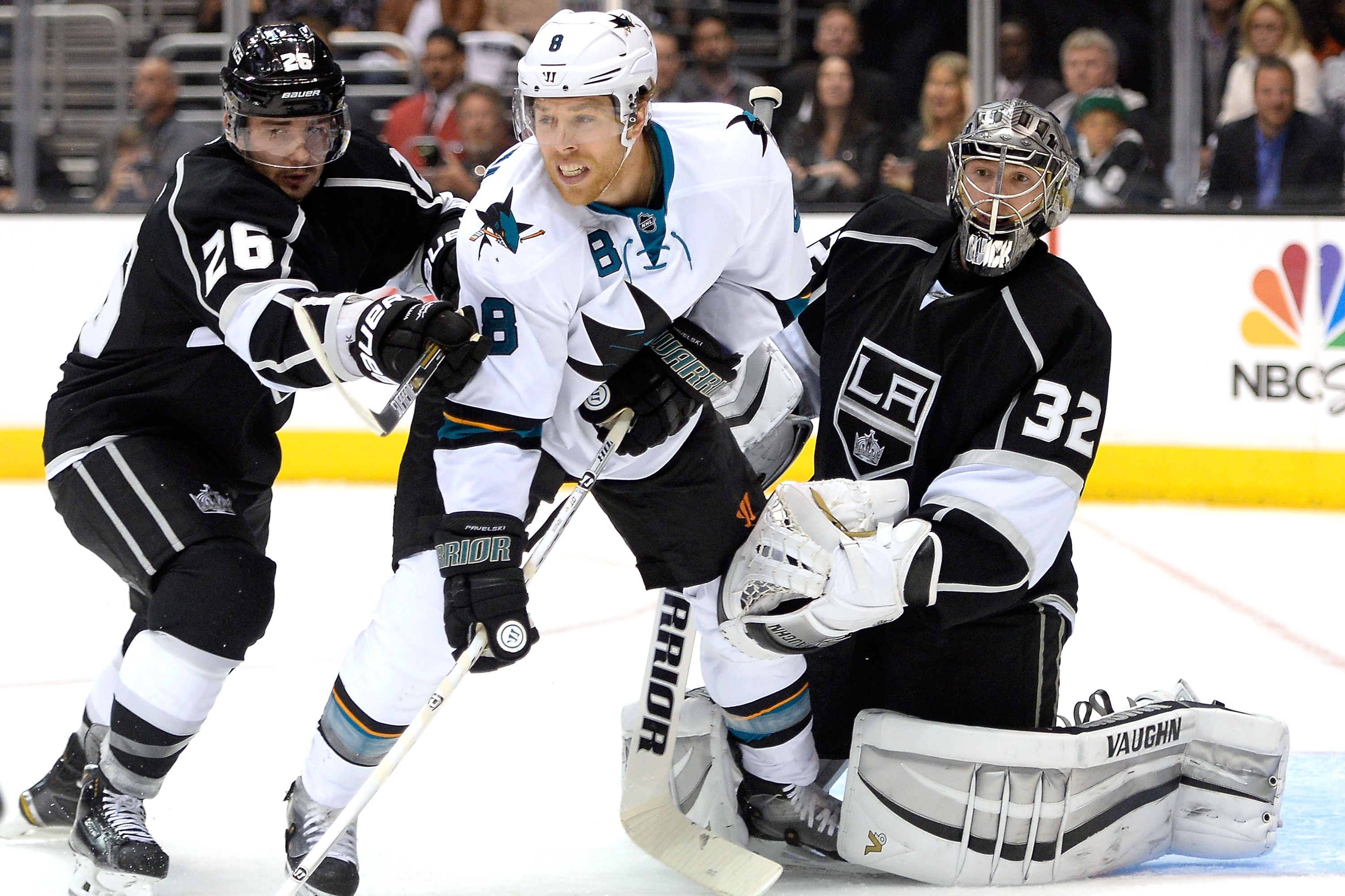 LOS ANGELES, CA - APRIL 24: Joe Pavelski #8 of the San Jose Sharks provides a screen in front of Jonathan Quick #32 of the Los Angeles Kings as Slava Voynov #26 attempts to move him during the first period in Game Four of the First Round of the 2014 NHL Stanley Cup Playoffs at Staples Center on April 24, 2014 in Los Angeles, California. (Photo by Harry How/Getty Images)