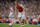 Arsenal's Calum Chambers controls the ball as he makes his debut during the Emirates Cup soccer match between Arsenal and Benfica at Arsenal's Emirates Stadium in London, Saturday, Aug. 2, 2014.  (AP Photo/Matt Dunham)