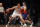 Dec 5, 2013; Brooklyn, NY, USA; Brooklyn Nets center Brook Lopez (11) controls the ball against New York Knicks power forward Andrea Bargnani (77) during the second quarter of a game at Barclays Center. Mandatory Credit: Brad Penner-USA TODAY Sports