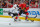 CHICAGO, IL - MAY 28: Nick Leddy #8 of the Chicago Blackhawks hits the puck past Kyle Clifford #13 of the Los Angeles Kings in Game Five of the Western Conference Final during the 2014 NHL Stanley Cup Playoffs at the United Center on May 28, 2014 in Chicago, Illinois. (Photo by Bill Smith/NHLI via Getty Images)