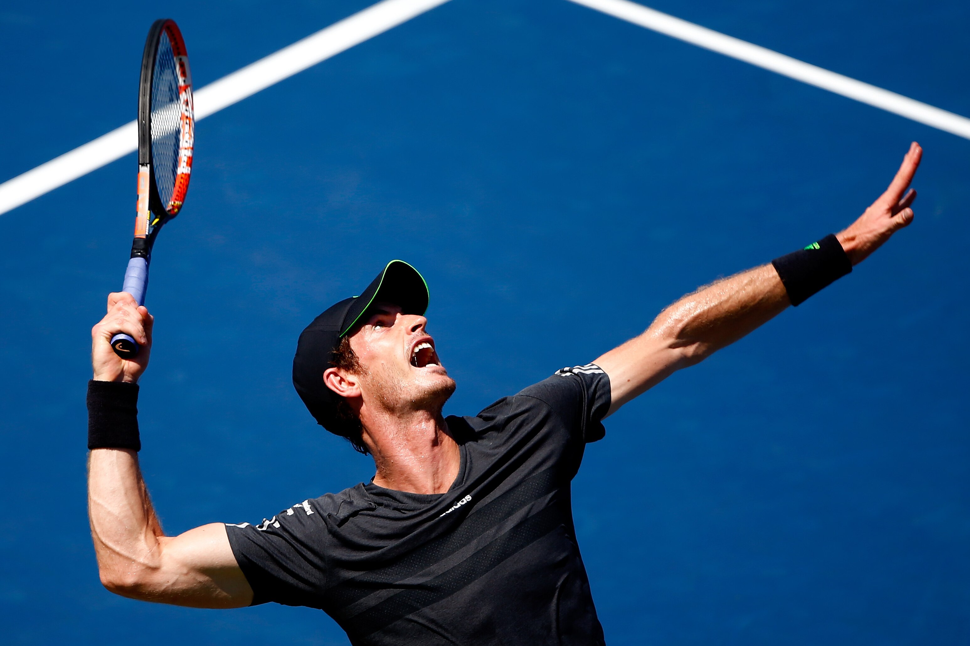 NEW YORK, NY - AUGUST 25: Andy Murray of Great Britain serves a shot against Robin Haase of the Netherlands during his men's singles first round match on Day One of the 2014 US Open at the USTA Billie Jean King National Tennis Center on August 25, 2014 in the Flushing neighborhood of the Queens borough of New York City. (Photo by Julian Finney/Getty Images)
