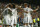 Real Madrid players celebrate after Basel's Marek Suchy scored an own goal to open the scoring during the Champions League Group B soccer match between Real Madrid and Basel at the Santiago Bernabeu stadium in Madrid, Spain, Tuesday Sept. 16, 2014. (AP Photo/Andres Kudacki)