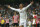 Real's Cristiano Ronaldo, right, celebrates his third goal during a Spanish La Liga soccer match between Real Madrid and Athletic Bilbao at the Santiago Bernabeu stadium in Madrid, Spain, Sunday, Oct. 5, 2014. (AP Photo/Andres Kudacki)