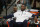 Oklahoma City Thunder forward Kevin Durant sits on bench before facing Denver Nuggets in the first quarter of an NBA exhibition basketball game in Denver on Wednesday, Oct. 8, 2014. (AP Photo/David Zalubowski)
