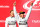 Lewis Hamilton celebrates his U.S. Grand Prix victory while teammate Nico Rosberg looks on.