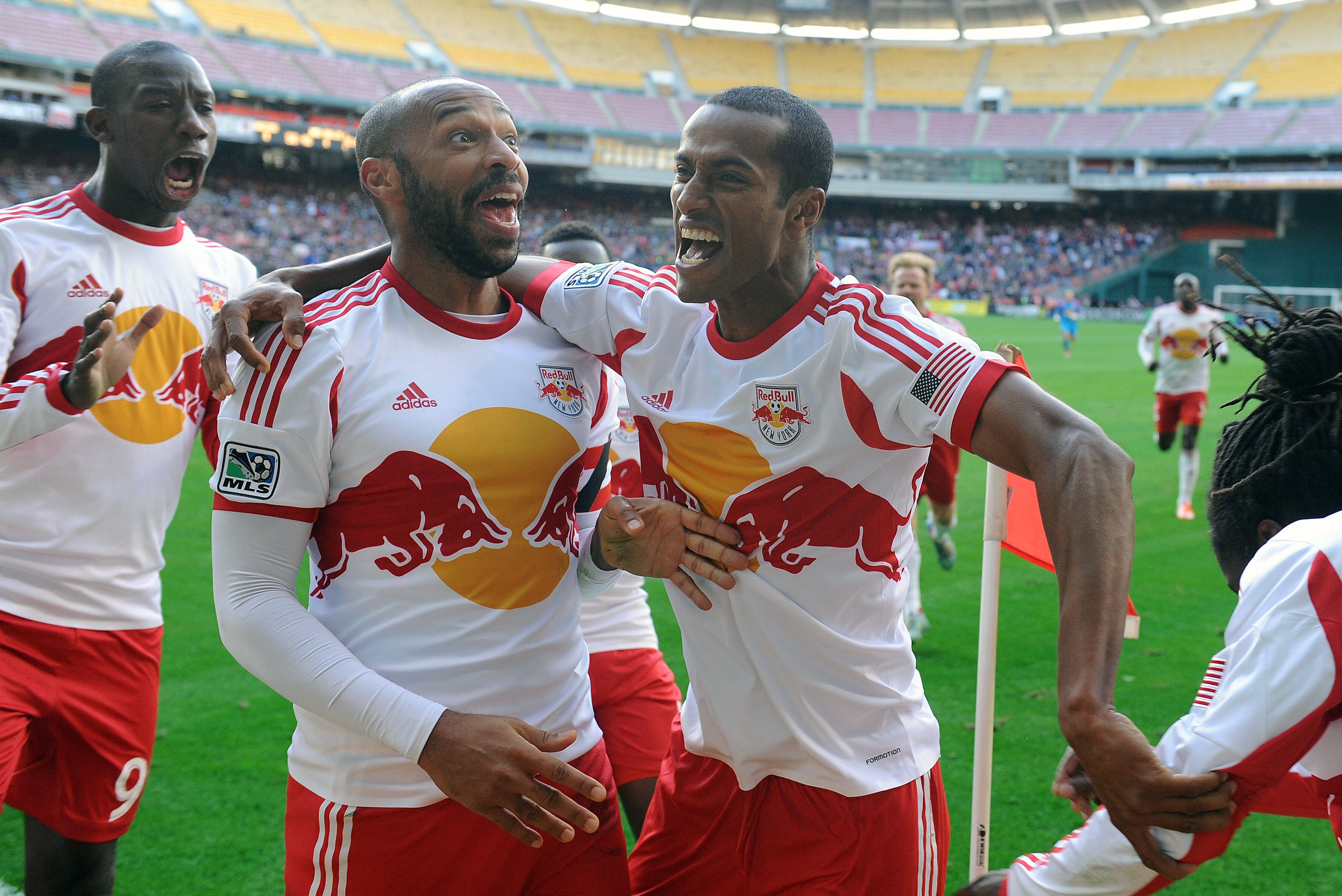 Thierry Henry and Roy Miller celebrate Peguy Luyindula's goal during New York's 2-1 loss at DC United on Saturday.
