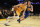 Apr 11, 2014; Los Angeles, CA, USA; Los Angeles Lakers forward Ryan Kelly (4) dribbles around Golden State Warriors forward David Lee (10) at Staples Center. Mandatory Credit: Richard Mackson-USA TODAY Sports