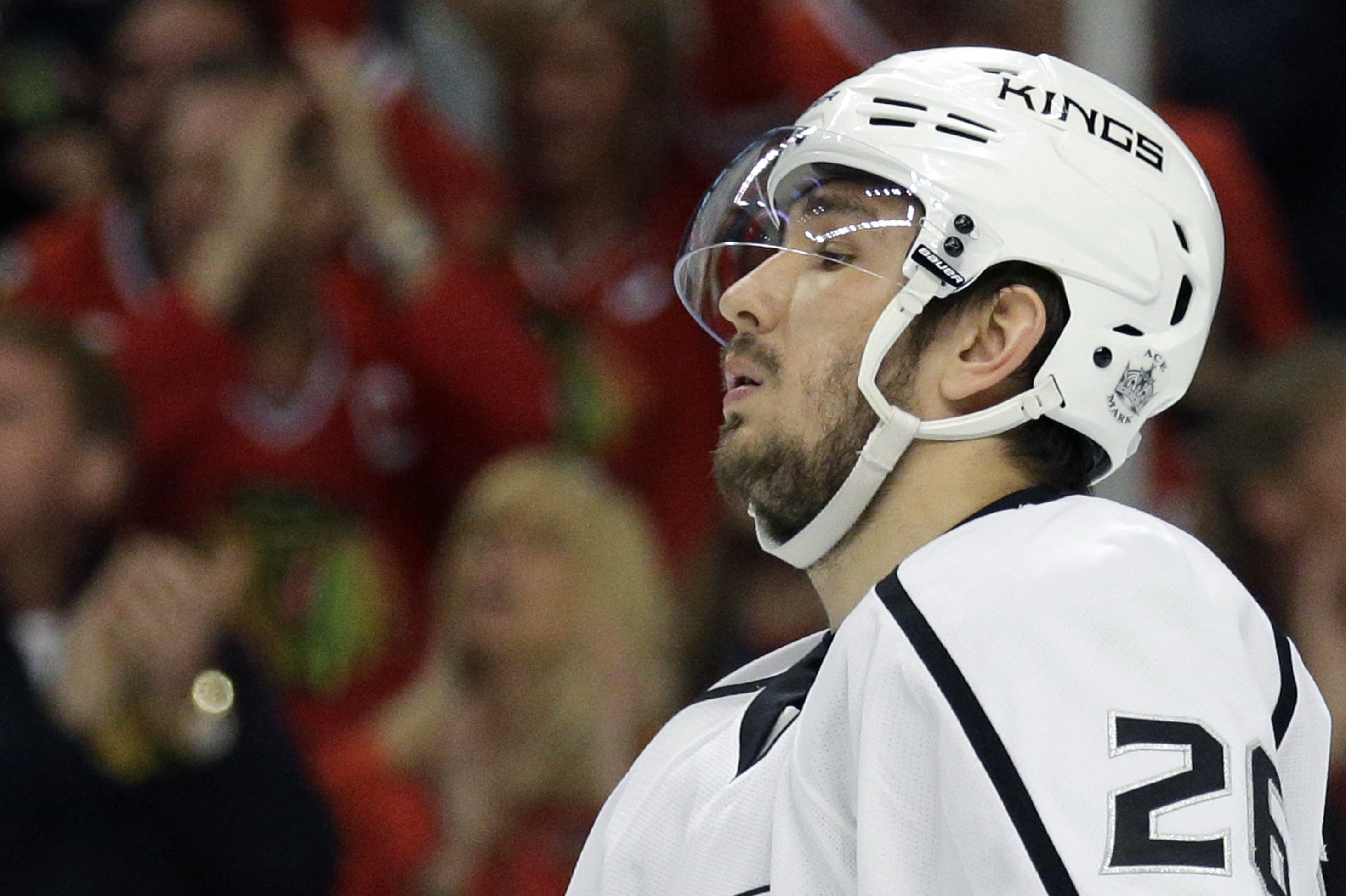 FILE - In this May 18, 2014, file photo, Los Angeles Kings' Slava Voynov reacts during the second period in Game 1 of the Western Conference finals in the NHL hockey Stanley Cup playoffs in Chicago. Voynov has been charged with felony domestic violence. The Los Angeles County district attorney’s office announced the charge Thursday, Nov. 20, 2014. Voynov faces one felony count of corporal injury to a spouse with great bodily injury. The district attorney’s office says Voynov “caused his wife to suffer injuries to her eyebrow, cheek and neck” during an argument. (AP Photo/Nam Y. Huh, File)