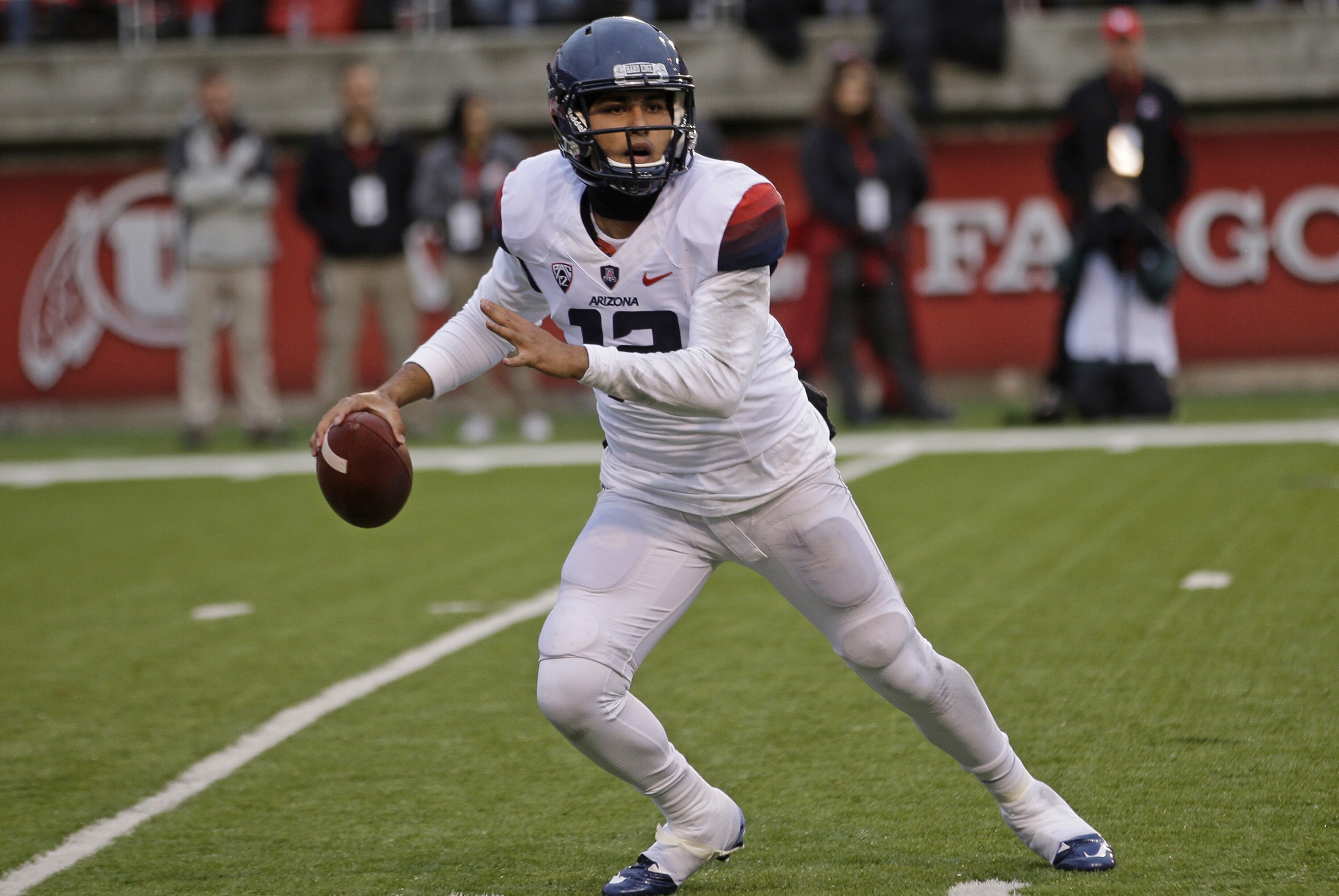 Arizona quarterback Anu Solomon (12) passes the ball in the first quarter during an NCAA college football game against Utah Saturday, Nov. 22, 2014, in Salt Lake City. (AP Photo/Rick Bowmer)