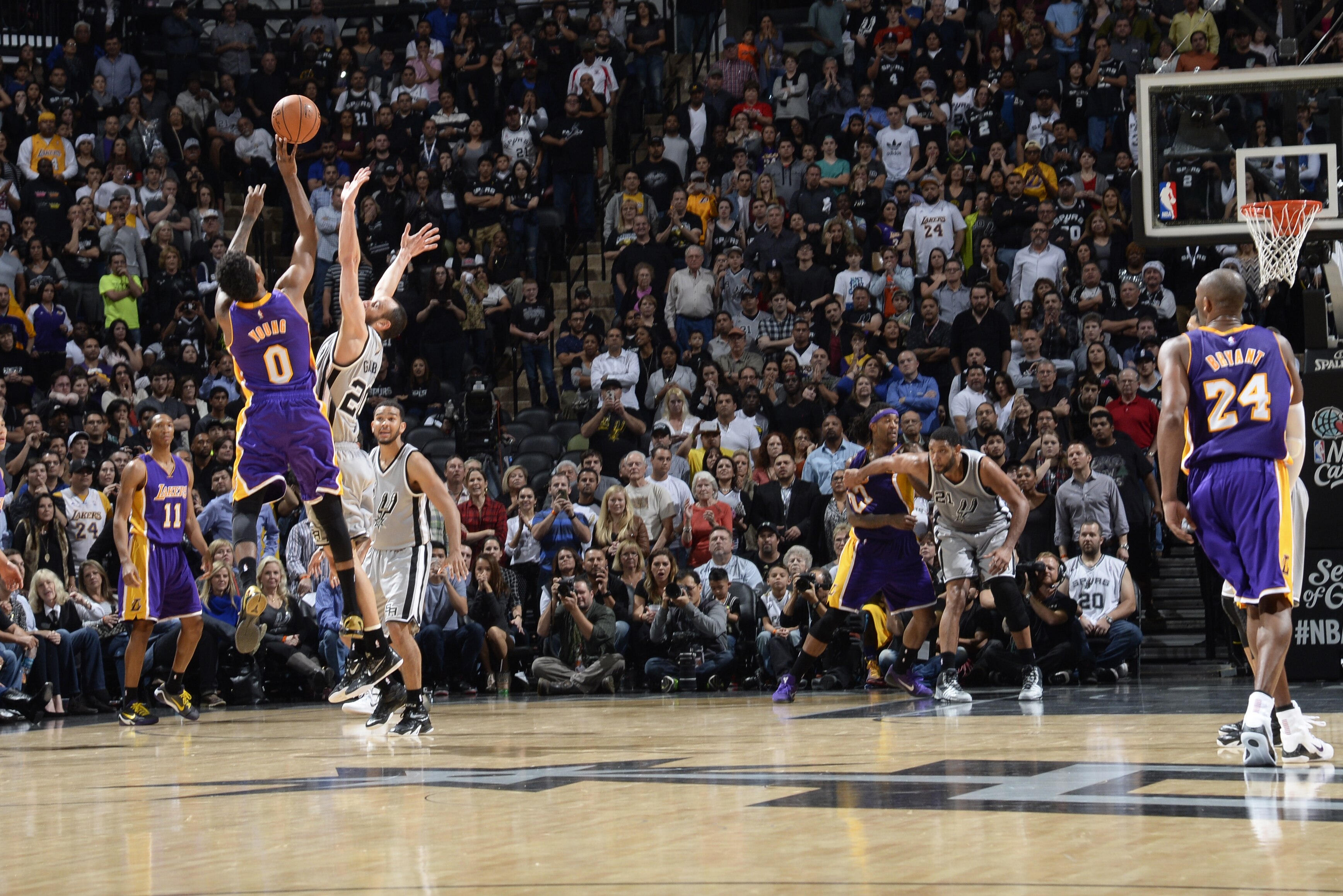 SAN ANTONIO - DECEMBER 12: Nick Young #0 of the Los Angeles Lakers takes a shot in the final seconds of OT to win the game against the San Antonio Spurs at the AT&T Center on December 12, 2014 in San Antonio, Texas. NOTE TO USER: User expressly acknowledges and agrees that, by downloading and or using this photograph, user is consenting to the terms and conditions of the Getty Images License Agreement. Mandatory Copyright Notice: Copyright 2014 NBAE (Photos by D. Clarke Evans/NBAE via Getty Images)