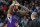 Sacramento Kings center DeMarcus Cousins, left, reacts after being called for his second personal foul as head coach Michael Malone talks to him during an NBA basketball game against the Denver Nuggest in Denver, Sunday, Feb. 23, 2014. (AP Photo/David Zalubowski)