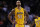 Los Angeles Lakers center Robert Sacre (50) walks upcourt during the final minute of an NBA basketball game against the Boston Celtics in Boston, Friday, Dec. 5, 2014. The Celtics defeated the Lakers 113-96. (AP Photo/Charles Krupa)