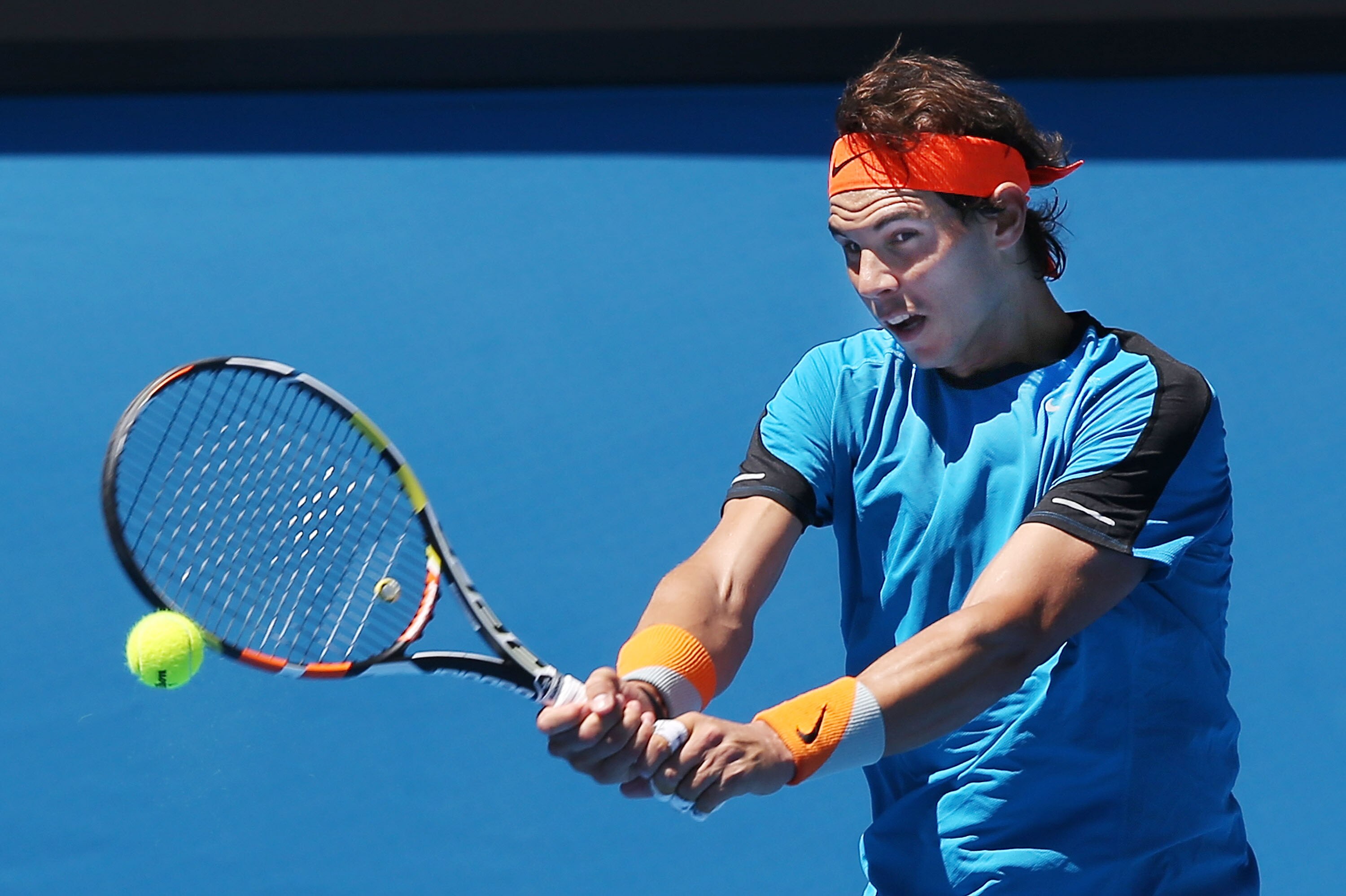 MELBOURNE, AUSTRALIA - JANUARY 16: Rafael Nadal of Spain hits a backhand during a practice session ahead of the 2015 Australian Open at Melbourne Park on January 16, 2015 in Melbourne, Australia. (Photo by Michael Dodge/Getty Images)