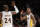 Los Angeles Lakers' Kobe Bryant, left, and Nick Young high-five during the second half of an NBA basketball game against the Toronto Raptors Sunday, Nov. 30, 2014, in Los Angeles. The Lakers won 129-122 in overtime. (AP Photo/Jae C. Hong)