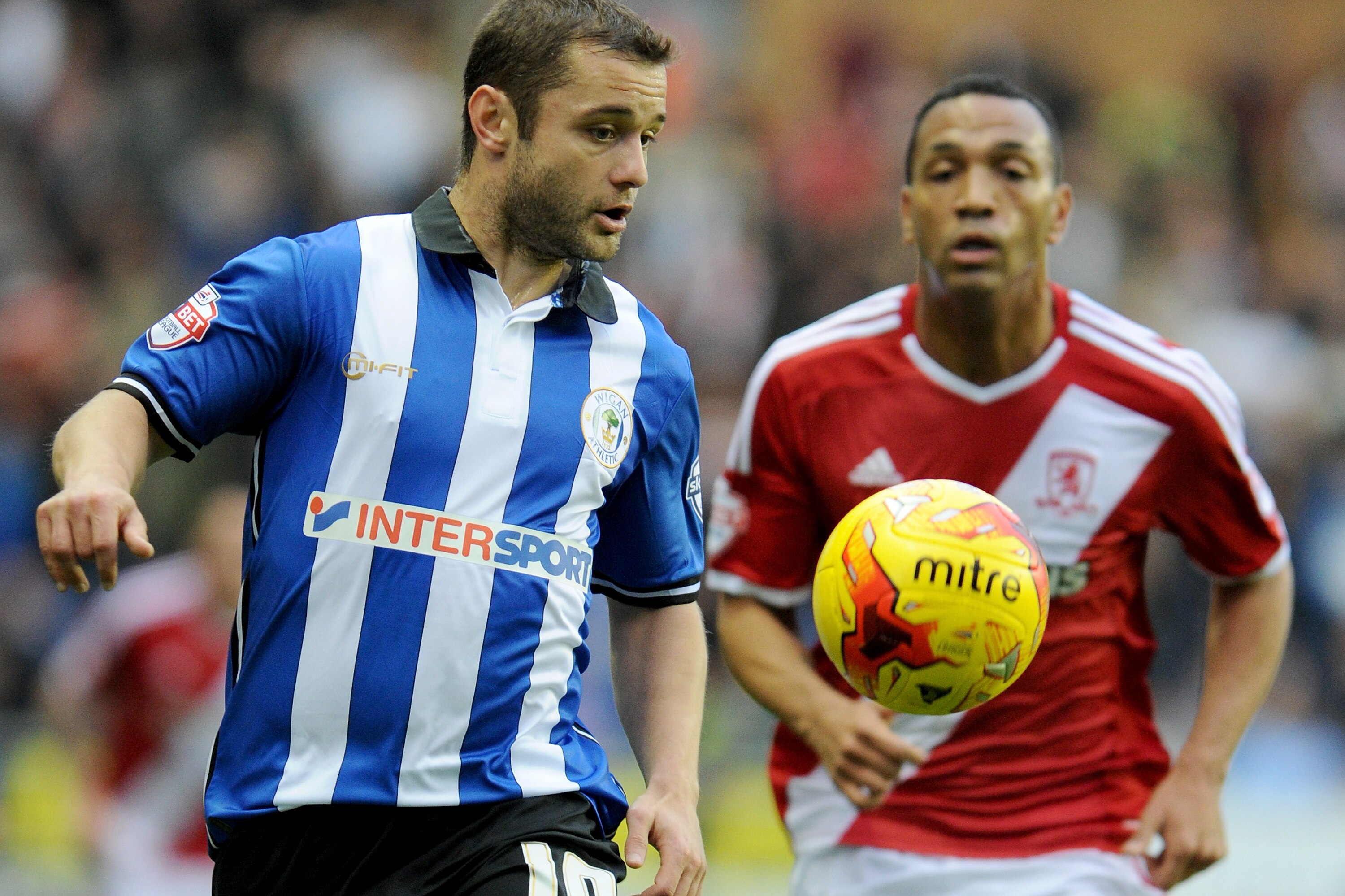 WIGAN, ENGLAND - NOVEMBER 22: Wigan Athletics Shaun Maloney (l) vies with Middlesbroughs Emilio Nsue during the Sky Bet Championship match between Wigan Athletic and Middlesbrough at DW Stadium on November 22, 2014 in Wigan, England. (Photo by Ryan Browne/Getty Images)