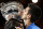 Novak Djokovic of Serbia kisses the trophy after defeating Andy Murray of Britain in the men's singles final at the Australian Open tennis championship in Melbourne, Australia, Sunday, Feb. 1, 2015. (AP Photo/Vincent Thian)