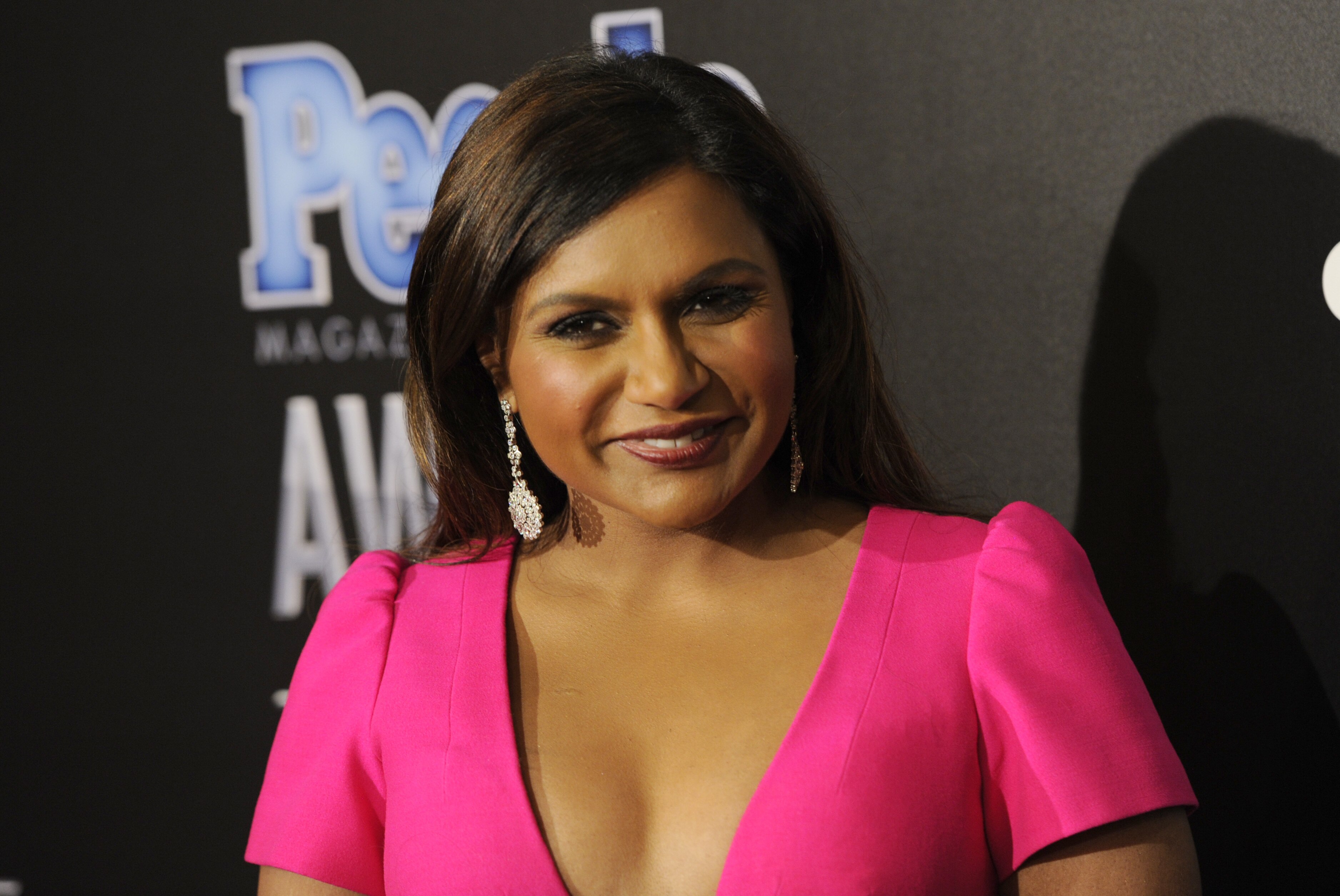 Mindy Kaling, winner of the award for TV couple of the year, poses in the press room at The People Magazine Awards at the Beverly Hilton hotel on Thursday, Dec. 18, 2014, in Beverly Hills, Calif. (Photo by Chris Pizzello/Invision/AP)
