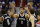 Brooklyn Nets guards Alan Anderson (6) and Bojan Bogdanovic (44), from Croatia, right, celebrate with center Brook Lopez (11) after a play in the second half of an NBA basketball game against the Washington Wizards, Friday, Jan. 16, 2015, in Washington. The Nets won 102-80.(AP Photo/Alex Brandon)