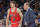 Chicago Bulls forward Doug McDermott (3) checks in while Chicago Bulls' head coach Tom Thibodeau talks to him during the first half of an NBA basketball game against the New York Knicks, Wednesday, Oct. 29, 2014, in New York. (AP Photo/Frank Franklin II)