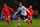 BOLTON, ENGLAND - FEBRUARY 04:  Tim Ream of Bolton Wanderers is marshalled by Adam Lallana of Liverpool during the FA Cup Fourth round replay between Bolton Wanderers and Liverpool at Macron Stadium on February 4, 2015 in Bolton, England.  (Photo by Alex Livesey/Getty Images)