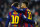FC Barcelona's Lionel Messi, from Argentina, left, reacts after scoring with his teammate Neymar, from Brazil, against Levante during a Spanish La Liga soccer match at the Camp Nou stadium in Barcelona, Spain, Sunday, Feb. 15, 2015. (AP Photo/Manu Fernandez)