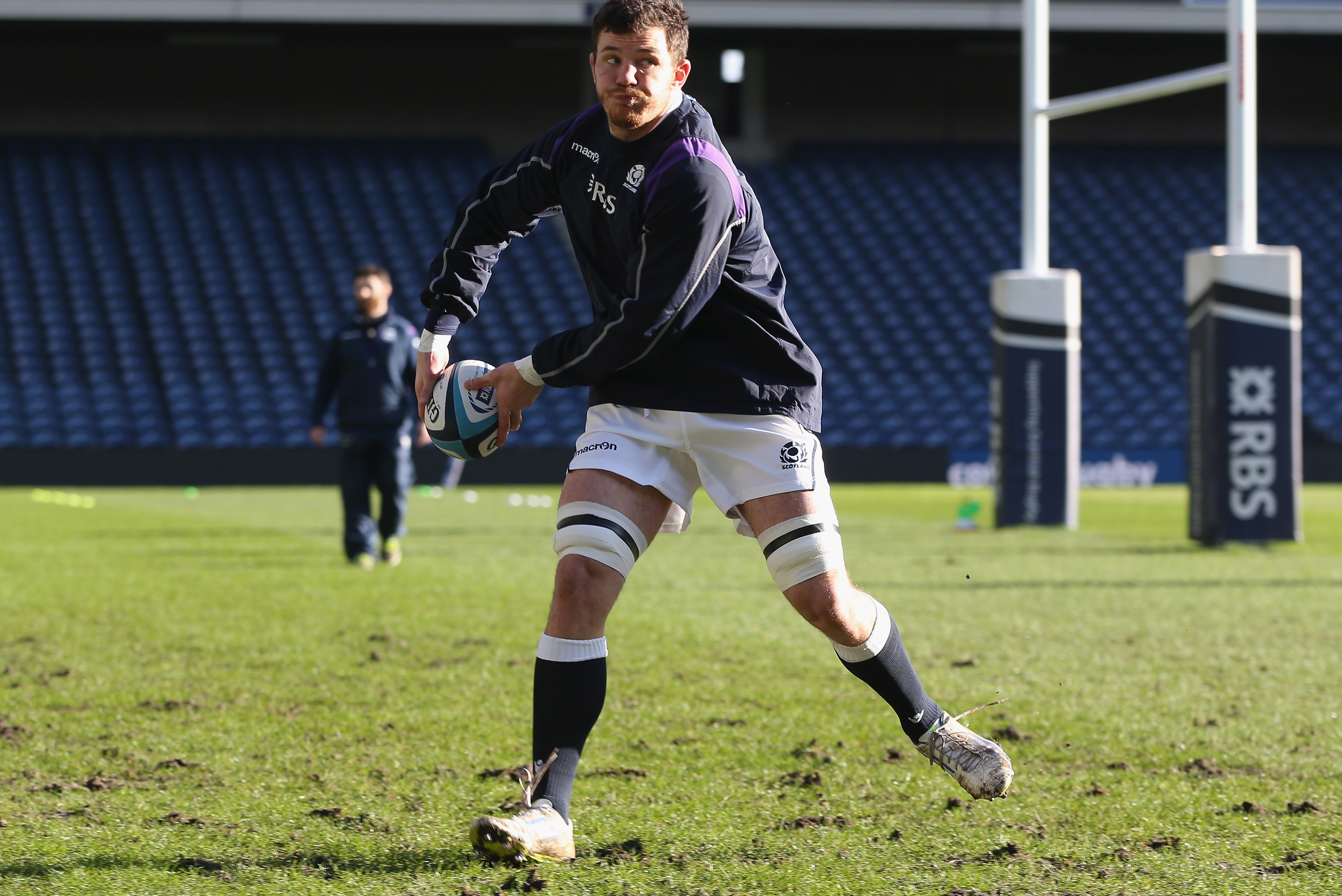 EDINBURGH, SCOTLAND - FEBRUARY 07: Tim Swinson passes the ball during the Scotland captain's run at Murrayfield Stadium on February 7, 2014 in Edinburgh, Scotland. (Photo by David Rogers/Getty Images)