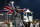 ABU DHABI, UNITED ARAB EMIRATES - NOVEMBER 23:  Lewis Hamilton of Great Britain and Mercedes GP celebrates in Parc Ferme after winning the World Championship and the Abu Dhabi Formula One Grand Prix at Yas Marina Circuit on November 23, 2014 in Abu Dhabi, United Arab Emirates.  (Photo by Dan Istitene/Getty Images)