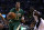 Boston Celtics guard Evan Turner (11) drives to the basket during the first quarter of an NBA basketball game in Boston, Friday, March 13, 2015. (AP Photo/Charles Krupa)