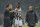 Referee Milorad Mazic, left, indicates Juventus' Paul Pogba, center, to leave the pitch after suffering an injury during the Champions League round of 16 second leg soccer match between Borussia Dortmund and Juventus Turin on Wednesday, March 18, 2015 in Dortmund, Germany. (AP Photo/Martin Meissner)