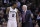 San Antonio Spurs head coach Gregg Popovich, right, talks with Kawhi Leonard (2) during the first half of an NBA basketball game against the Milwaukee Bucks, Sunday, Jan. 25, 2015, in San Antonio. (AP Photo/Eric Gay)