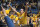 West Virginia student Brian Blend of Buckhannon, W.Va., celebrates with fans on the basketball court following the Mountaineers 70-65 win over No. 2 UCLA Saturday, Feb. 10, 2007 in Morgantown, W.Va. (AP Photo/Jeff Gentner)