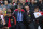 Chelsea's manager Jose Mourinho, center left, makes his way from the opposition dugout after greeting Manchester United manager Louis van Gaal, centre right, during their English Premier League soccer match between Manchester United and Chelsea at Old Trafford Stadium, Manchester, England, Sunday Oct. 26, 2014. (AP Photo/Jon Super)