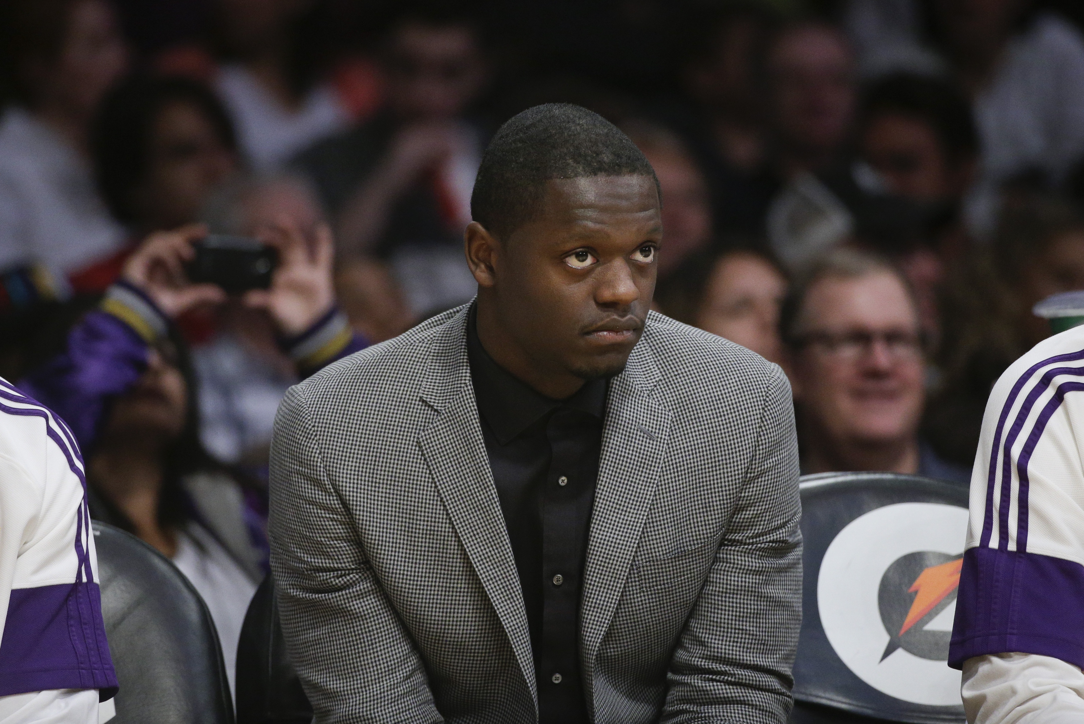 Los Angeles Lakers' Julius Randle watches from the bench during the second half of an NBA basketball game against the Utah Jazz, Thursday, March 19, 2015, in Los Angeles. The Jazz 80-73. (AP Photo/Jae C. Hong)