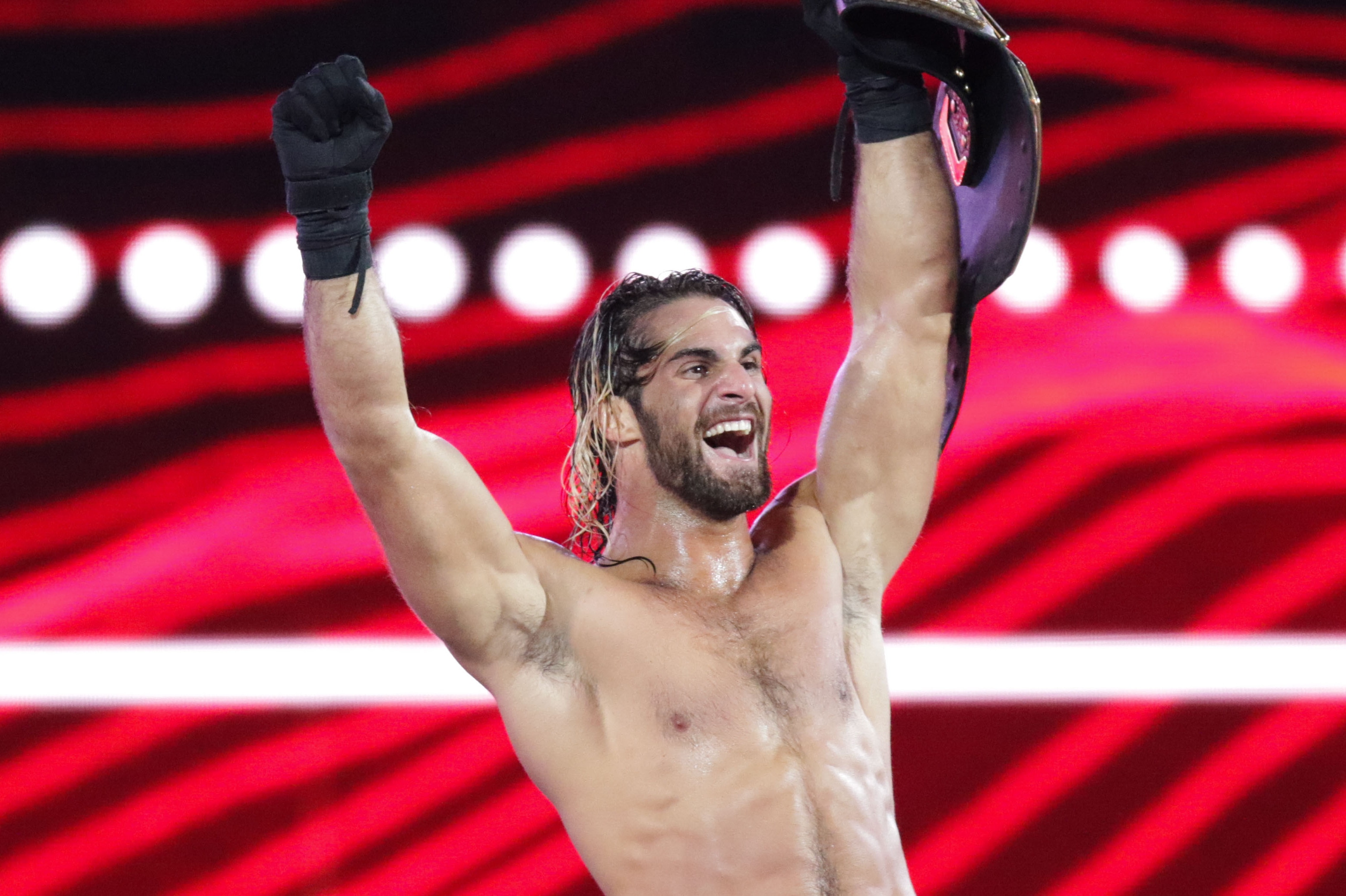 WWE Superstar Seth Rollins celebrates becoming the new WWE World Heavyweight Champion at WrestleMania 31 at Levi's Stadium on Sunday, March 29, 2015 in Santa Clara, CA. WrestleMania broke the Levi’s Stadium attendance record at 76,976 fans from all 50 states and 40 countries. (Don Feria/AP Images for WWE)