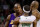 Los Angeles Lakers guard Kobe Bryant (24) points to Boston Celtics guard Rajon Rondo (9) after a foul in the second half of an NBA basketball game in Boston, Thursday Feb. 5, 2009. The Lakers beat the beat the Celtics 110-109 in overtime.  At right holding Rondo is Celtics guard Ray Allen. (AP Photo/Charles Krupa)