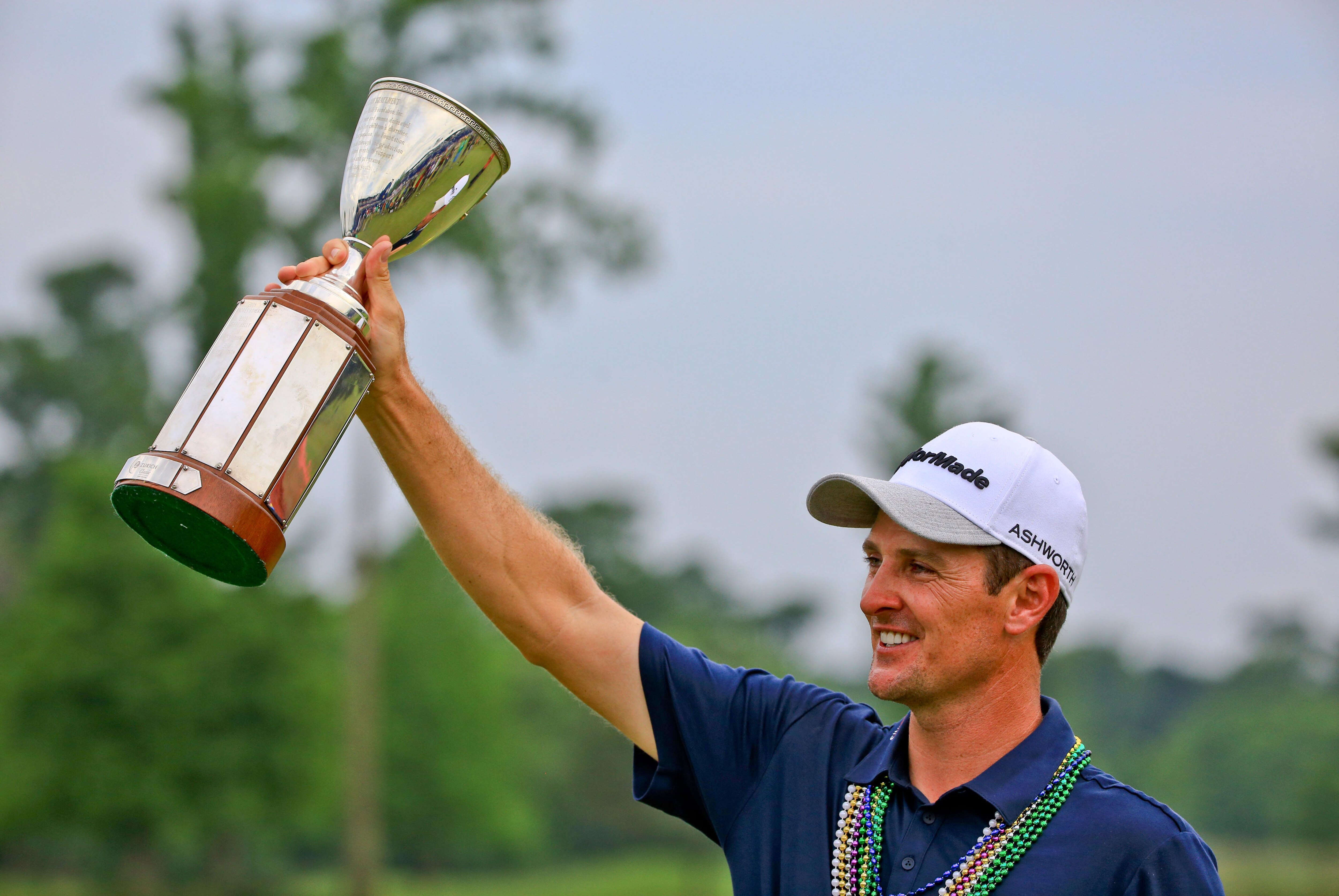 Apr 26, 2015; Avondale, LA, USA; Justin Rose holds up the Zurich Classic championship trophy following his win in the final round of the Zurich Classic at TPC Louisiana. Mandatory Credit: Derick E. Hingle-USA TODAY Sports