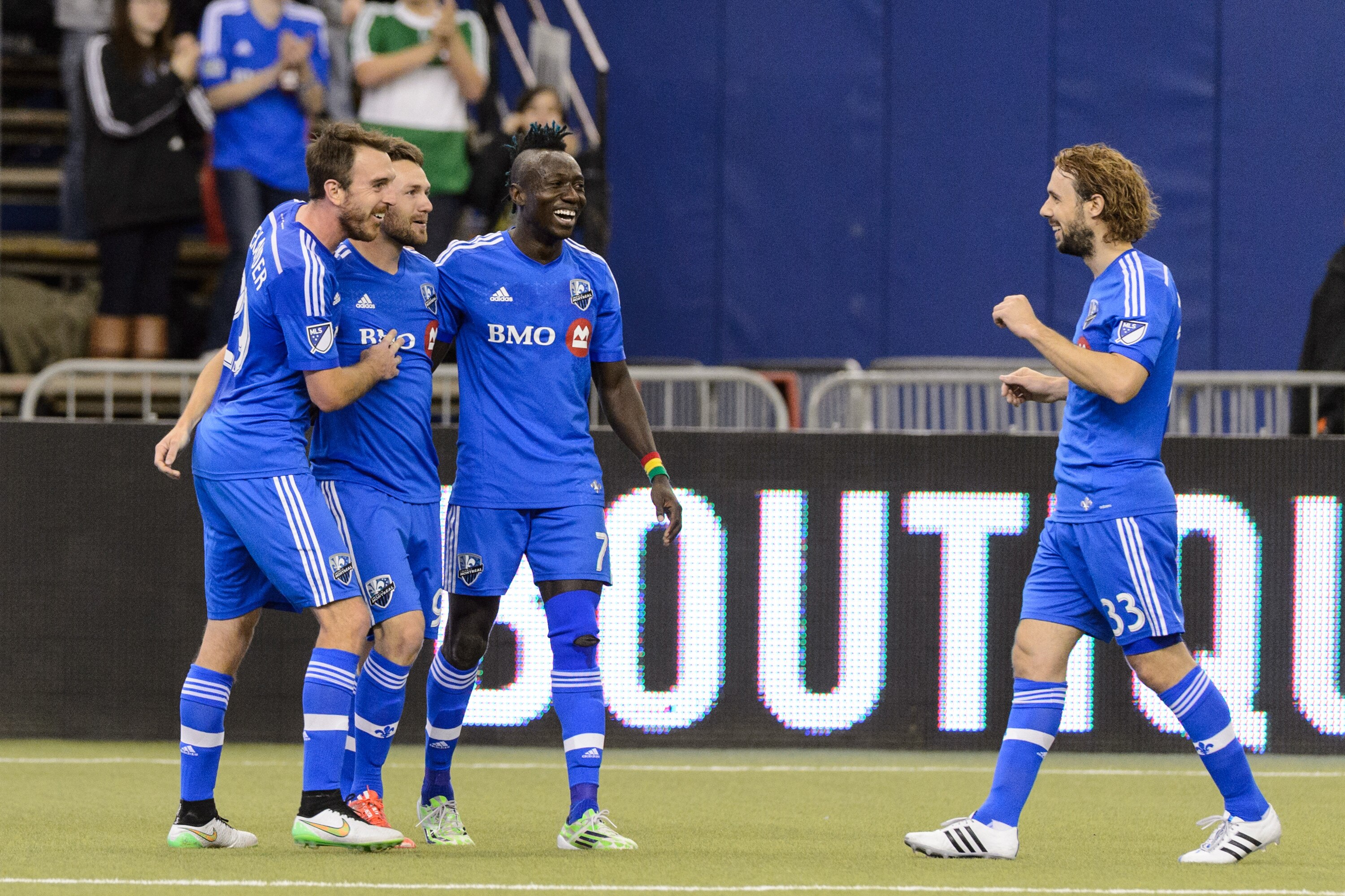 MONTREAL, QC - MARCH 28: Jack McInerney #99 of Montreal Impact celebrates his goal with teammates during the MLS game against the Orlando City SC at the Olympic Stadium on March 28, 2015 in Montreal, Quebec, Canada. (Photo by Minas Panagiotakis/Getty Images)