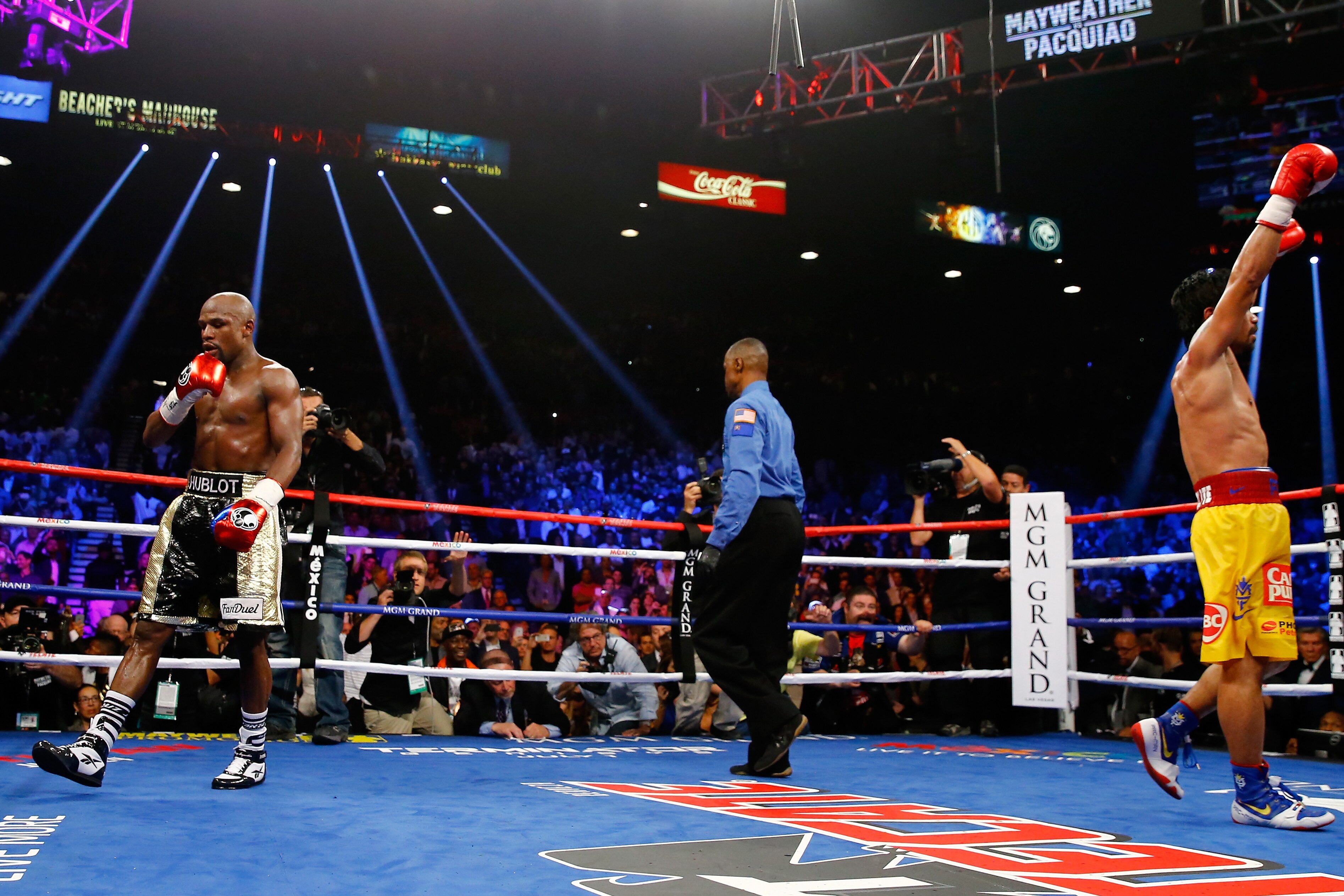 LAS VEGAS, NV - MAY 02:  Floyd Mayweather Jr.  Manny Pacquiao react after the twelfth round during their welterweight unification championship bout on May 2, 2015 at MGM Grand Garden Arena in Las Vegas, Nevada.  (Photo by Al Bello/Getty Images)