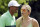 Lindsey Vonn speaks to Tiger Woods during the Par 3 contest at the Masters golf tournament Wednesday, April 8, 2015, in Augusta, Ga. (AP Photo/Charlie Riedel)