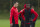 Manchester United's Robin van Persie, left, speaks to teammate Wilfried Zaha during a training session at Carrington training ground in Manchester, Tuesday, Oct. 22, 2013. Manchester United will play Real Sociedad in a Champion's League Group A soccer match on Wednesday. (AP Photo/Jon Super)