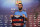 FC Barcelona's new signing Arda Turan poses for the media with his jersey during his official presentation at the Camp Nou stadium in Barcelona, Spain, Friday, July 10, 2015. The European champions announced a five-year deal for the 28-year-old Turkey midfielder. Barcelona made the signing despite currently being without a permanent president or executive board members, who resigned under club bylaws before elections on July 18. (AP Photo/Manu Fernandez)