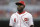 Cincinnati Reds second baseman Brandon Phillips (4) walks back to the dugout in the third inning of a baseball game against the Detroit Tigers, Wednesday, June 17, 2015, in Cincinnati. The Reds won 8-4. (AP Photo/John Minchillo)