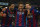 FC Barcelona's Lionel Messi, from Argentine, right, Neymar, from Brazil, center, and Luis Suarez, from Uruguay, celebrate after scoring against Atletico Madrid during a Spanish La Liga soccer match at the Camp Nou stadium in Barcelona, Spain, Sunday, Jan. 11, 2015. (AP Photo/Siu Wu)