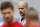 Bayern's head coach Pep Guardiola watches new player Arturo Vidal from Chile , right,  and Xabi Alonso from Spain during the a training session in Munich, Germany, on Wednesday, July 29, 2015. (AP Photo/Matthias Schrader)