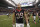Houston Texans defensive end J.J. Watt leaves the field after an NFL football game against the St. Louis Rams Sunday, Oct. 13, 2013, in Houston, Texas. The Rams won 38-13. (AP Photo/J. Patric Schneider)